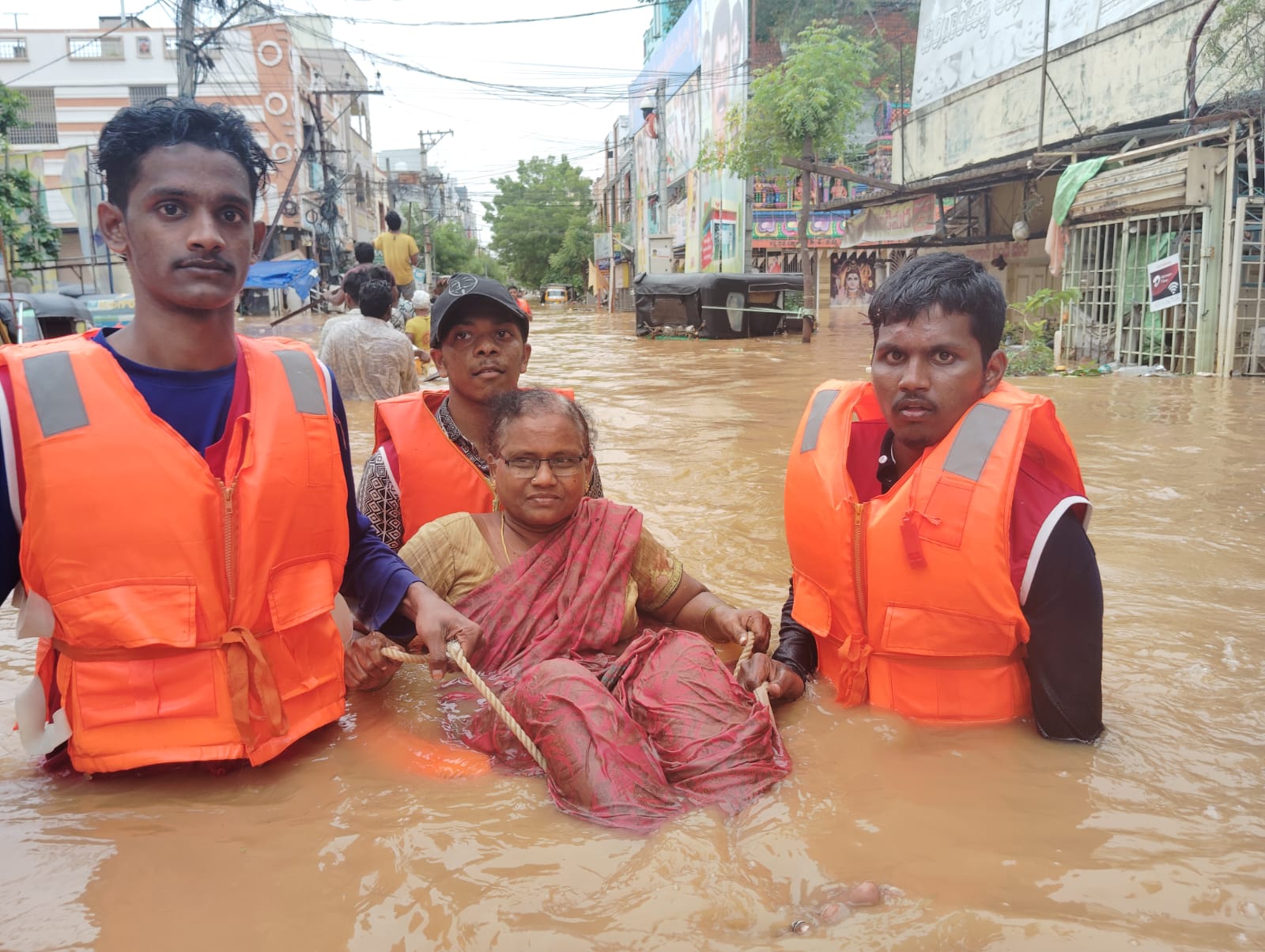 DISTRIBUTION OF FOOD AND HELPING FLOOD VICTIMS IN VIJAYAWADA